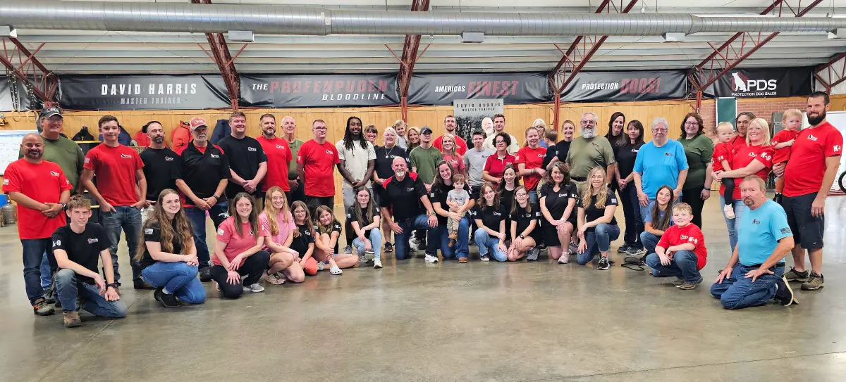 David Harris with a home-raised family protection dog from Prufenpuden bloodlines
